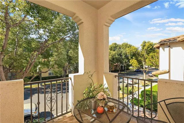a view of a balcony with wooden floor