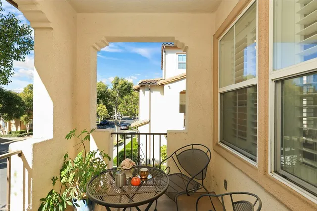 a front view of a house with outdoor seating