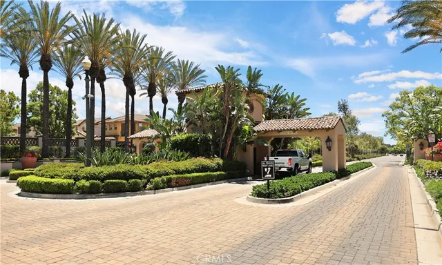 a front view of a house with garden and mountain view