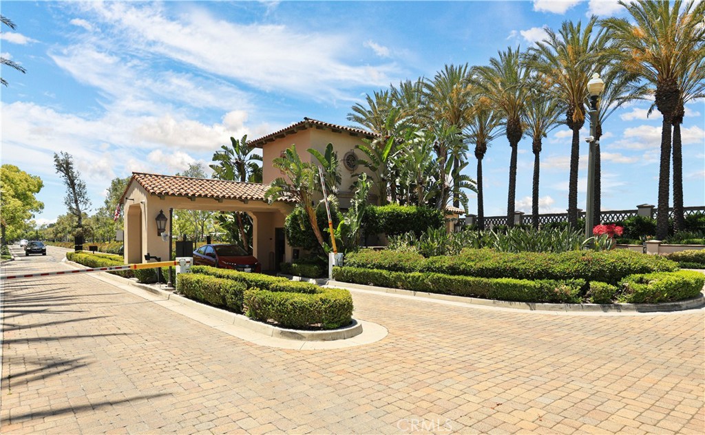 51 Olivehurst Irvine, CA 92602 - Photo 32 of 45 a view of a white house with a yard and potted plants