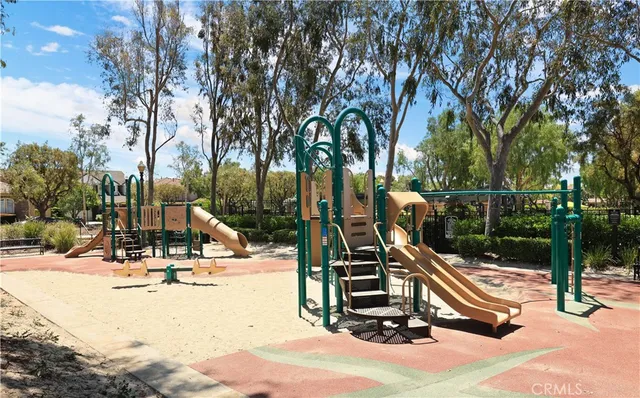 a view of a park with swings and slides