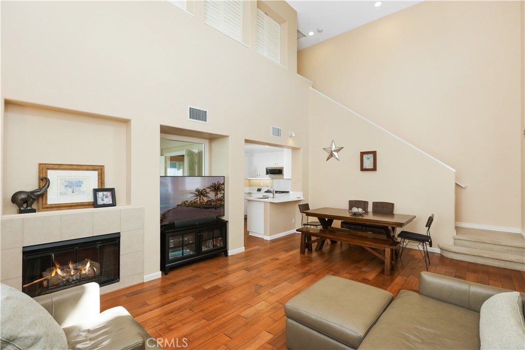 51 Olivehurst Irvine, CA 92602 - Photo 4 of 45 a living room with furniture and a fireplace