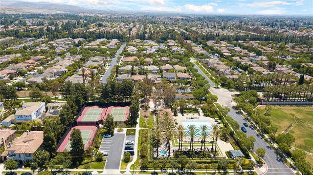 an aerial view of residential houses with city view