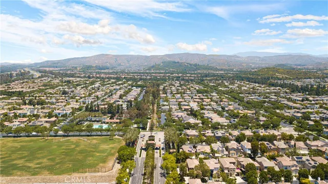 an aerial view of residential building and ocean