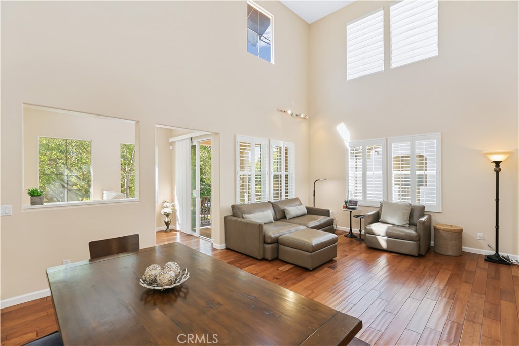 51 Olivehurst Irvine, CA 92602 - Photo 7 of 45 a living room with furniture and a wooden floor