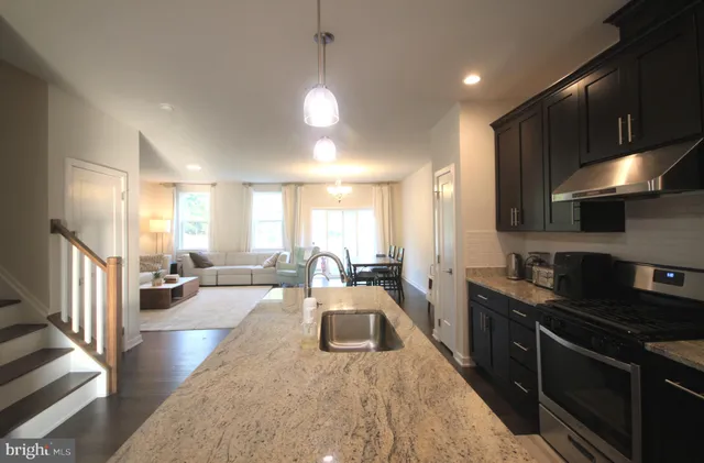 a large room with lots of counter space and windows