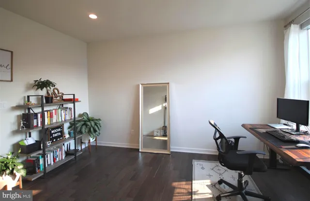 a workspace with furniture and wooden floor