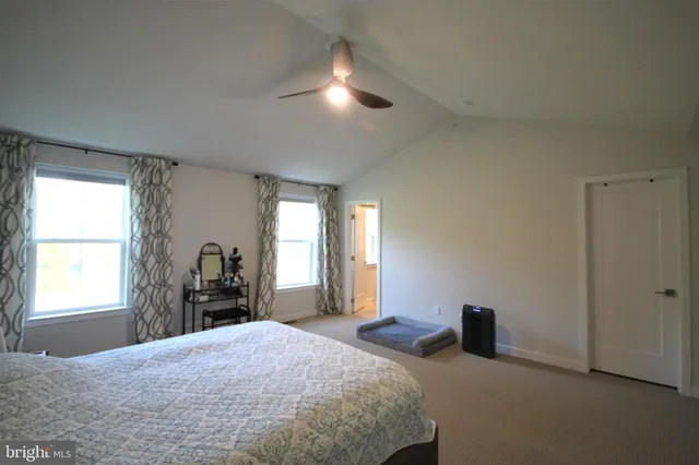 a bedroom with a bed and a closet