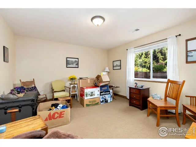 a bedroom with furniture and a window
