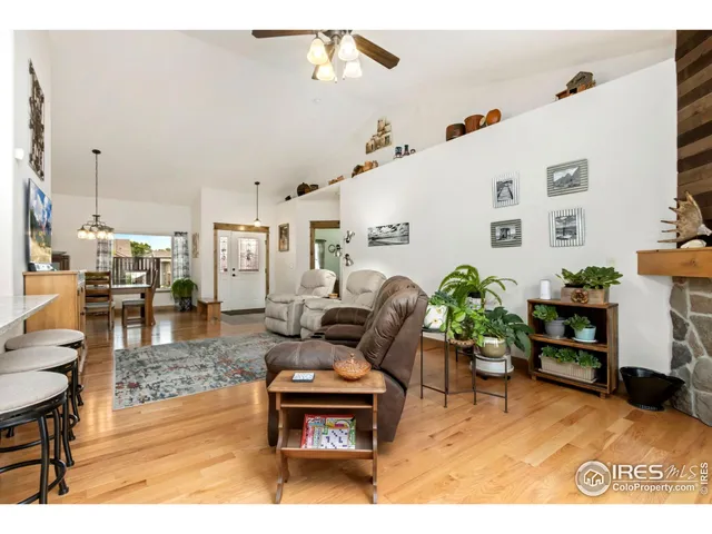 a living room with furniture and a dining area