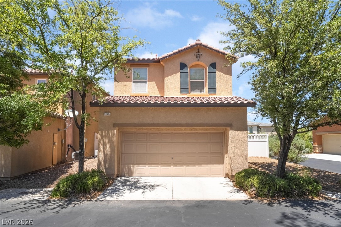 3175 Via Seranova Henderson, NV 89044 - Photo 5 of 45 This appealing two-story residence features an attached garage and a classic tile roof.