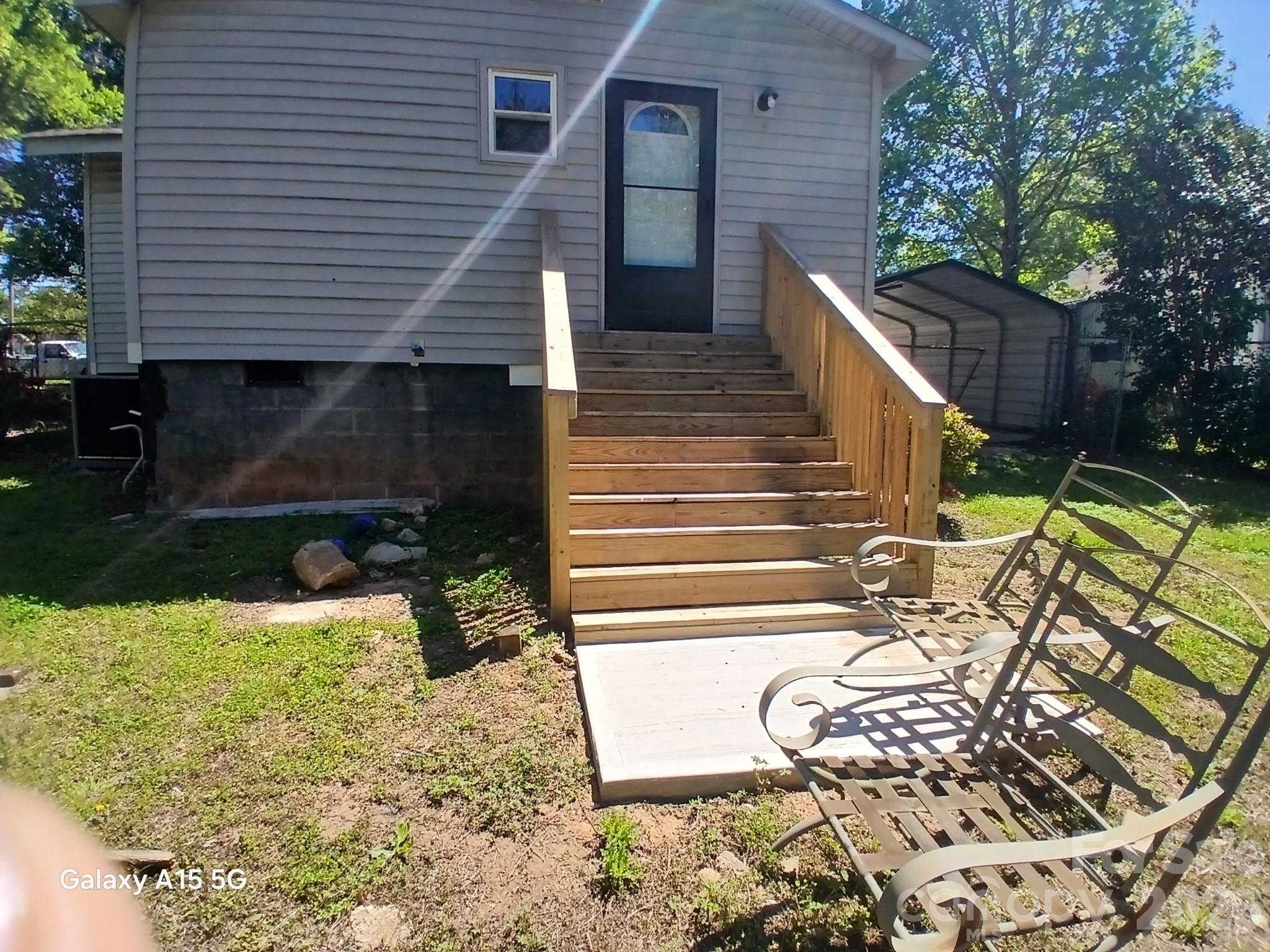 634 Oates Road Gastonia, NC 28052 - Photo 25 of 33 a view of a house with backyard and sitting area