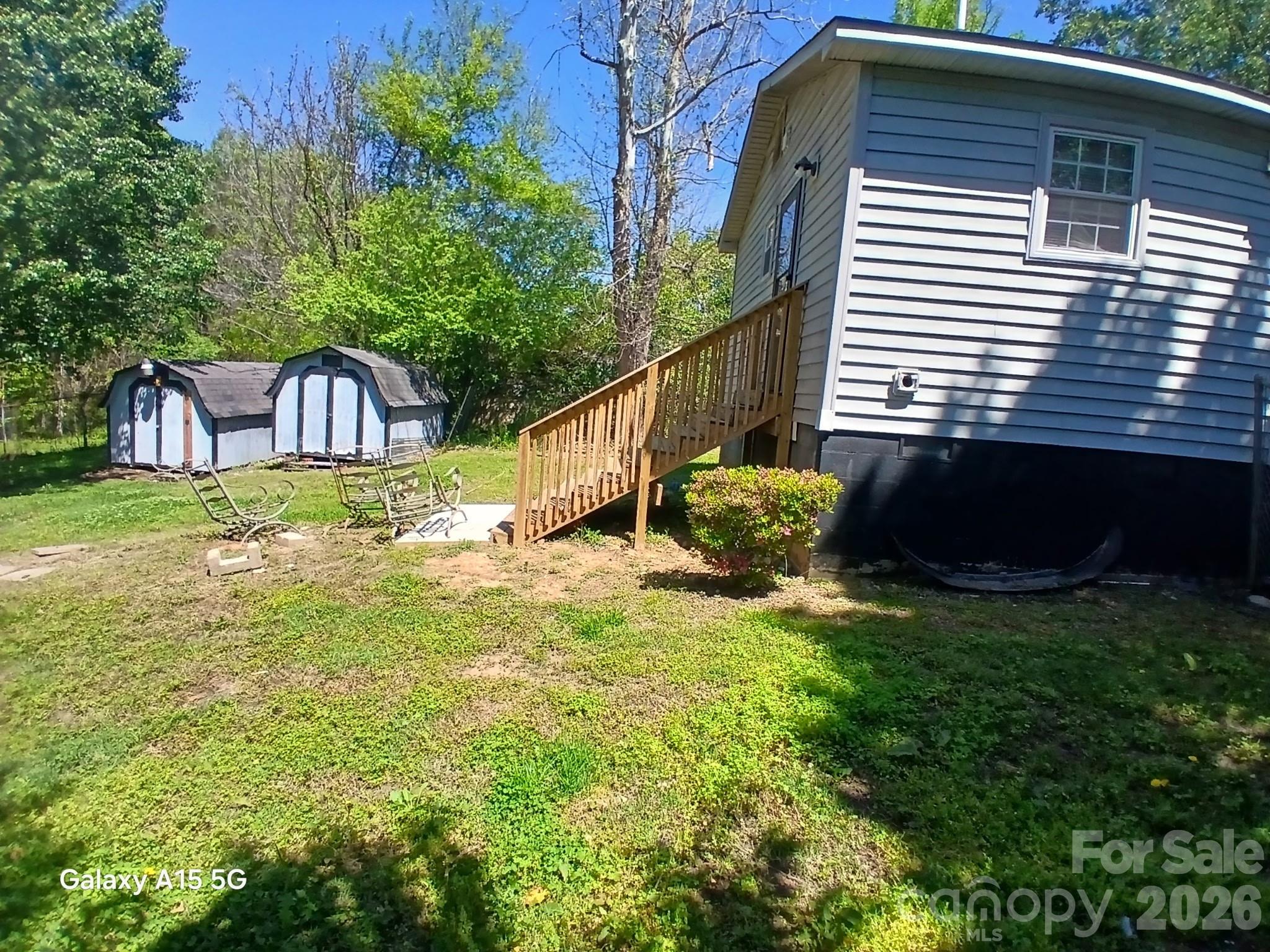 634 Oates Road Gastonia, NC 28052 - Photo 33 of 33 a view of a backyard with plants and a patio