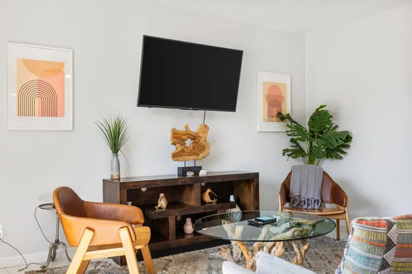 a living room with furniture and a flat screen tv