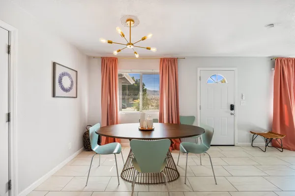 a view of a dining room with furniture window and outside view