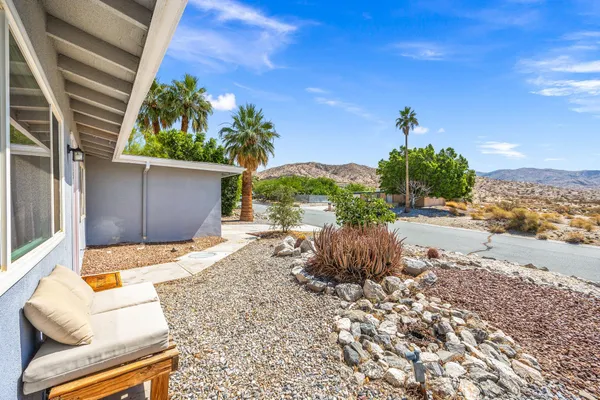 a view of a backyard of the house