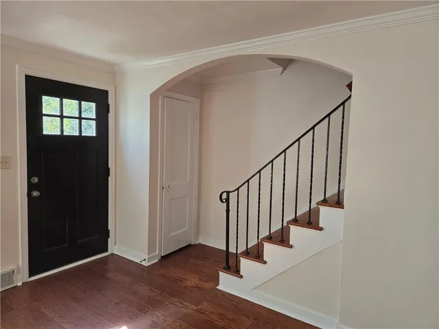 a view of livingroom with furniture fireplace and wooden floor