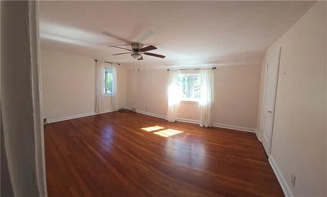 a view of a yard with a tree