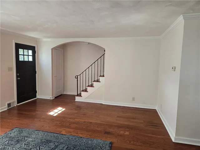 a view of a dining room with furniture and window
