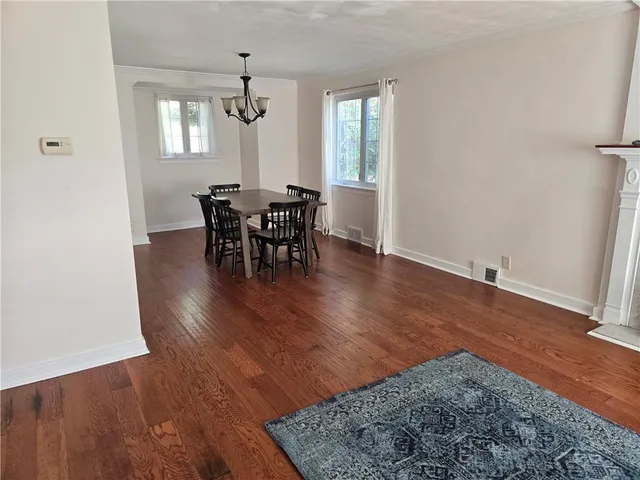 a utility room with cabinets washer and dryer