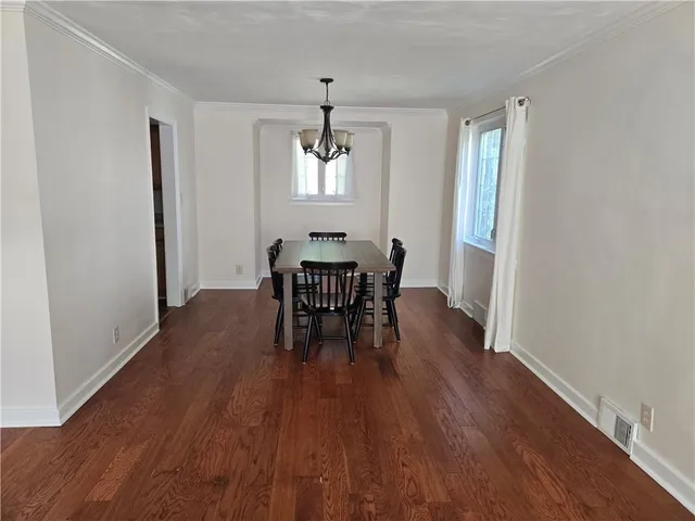 a white refrigerator freezer and a stove sitting inside of a kitchen