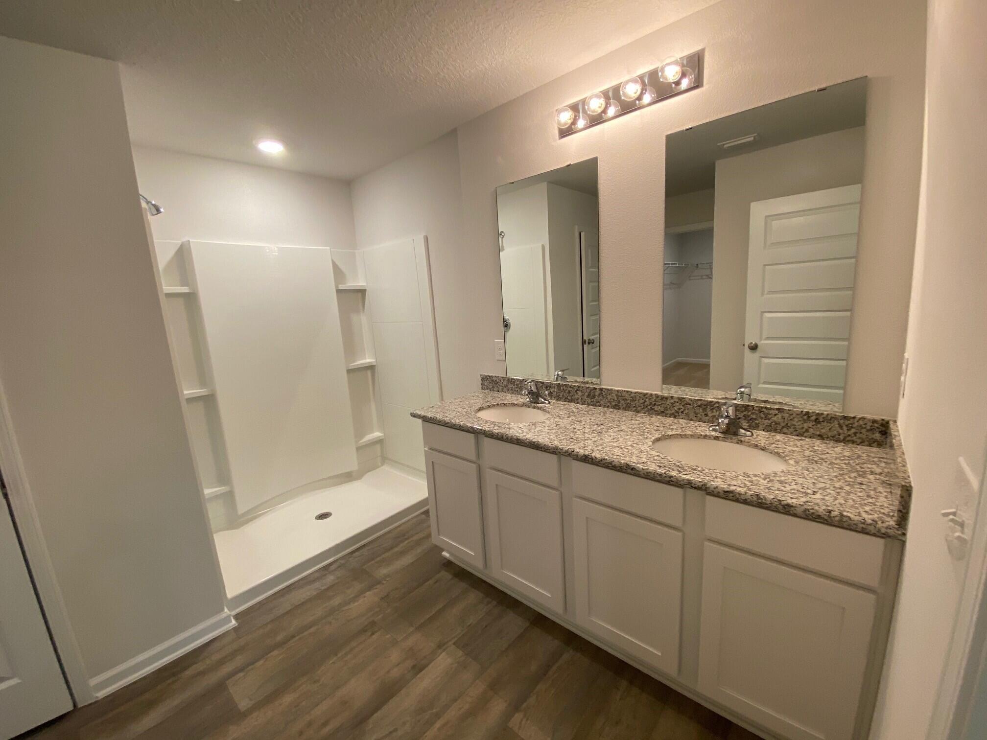 2806 Patriot Ridge Crestview, FL 32539 - Photo 10 of 18 a bathroom with a granite countertop sink mirror and double