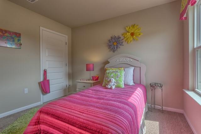 2806 Patriot Ridge Crestview, FL 32539 - Photo 11 of 18 a bedroom with a bed and a dresser
