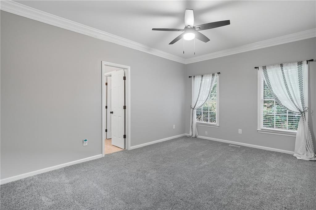 5090 Eubanks Road Woodstock, GA 30188 - Photo 29 of 54 a view of an empty room with a window
