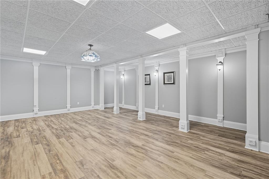 5090 Eubanks Road Woodstock, GA 30188 - Photo 44 of 54 a view of an empty room with wooden floor
