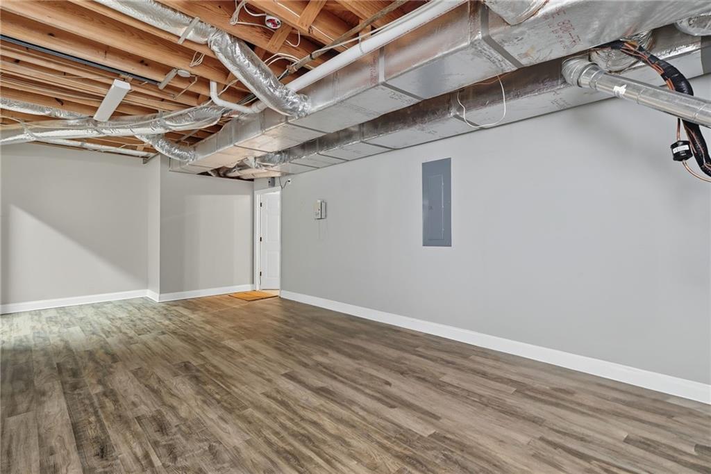 5090 Eubanks Road Woodstock, GA 30188 - Photo 45 of 54 a view of a room with wooden floor