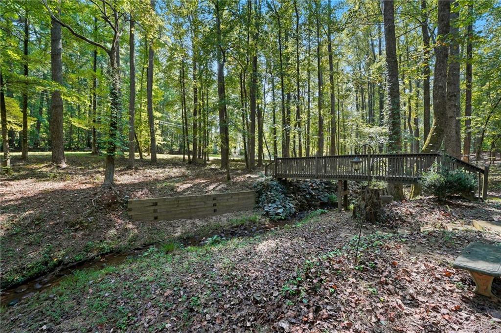 5090 Eubanks Road Woodstock, GA 30188 - Photo 53 of 54 a view of outdoor space with trees all around