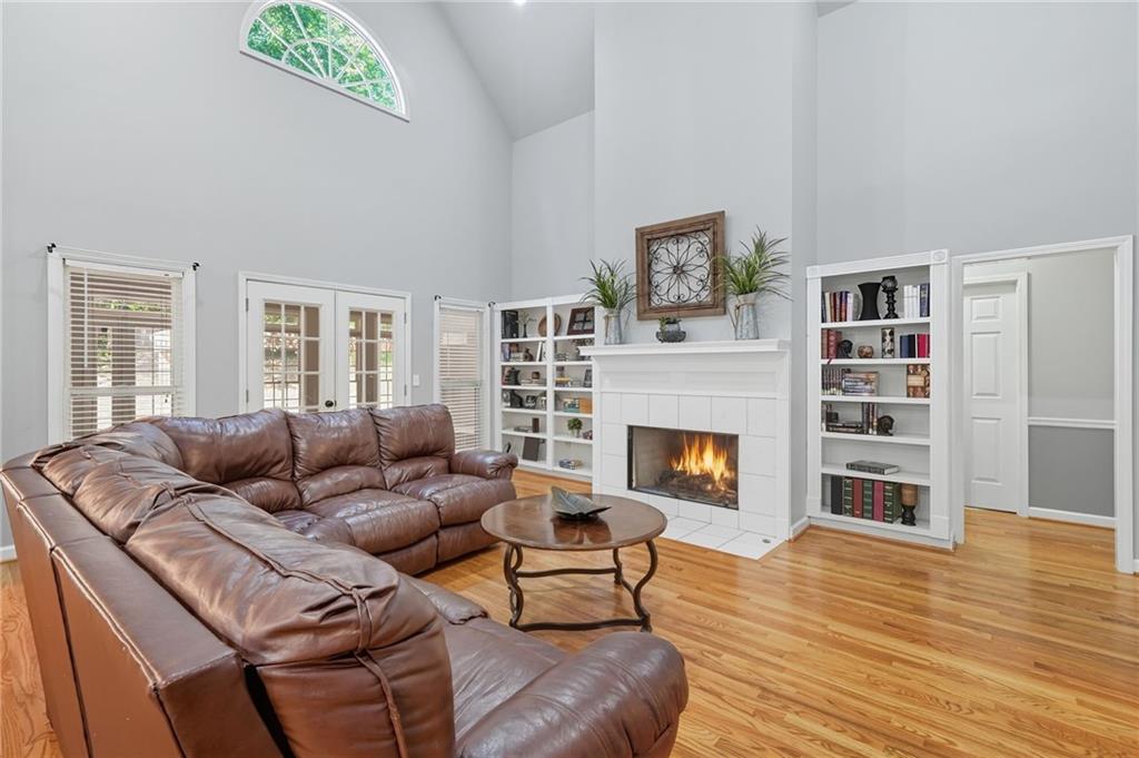 5090 Eubanks Road Woodstock, GA 30188 - Photo 8 of 54 a living room with furniture and a fireplace