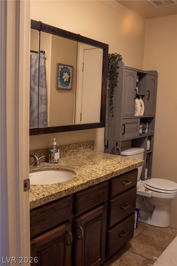 2775 Taylor Street Logandale, NV 89021 - Photo 22 of 41 This bathroom features a sleek vanity with ample storage and a contemporary mirror.