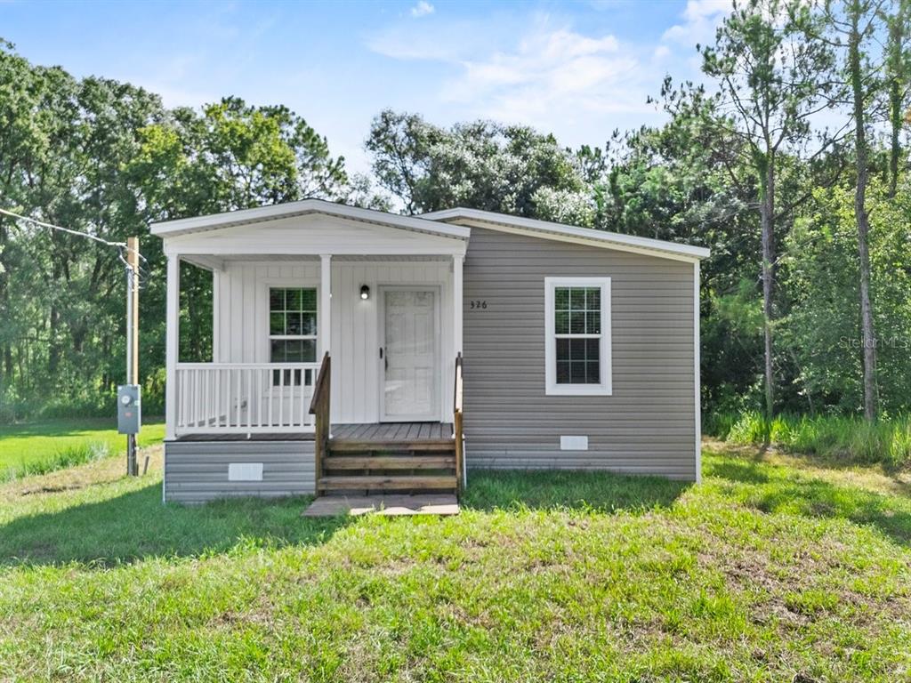 811 North Swindell Avenue, Unit 2 Lakeland, FL 33815 - Photo 1 of 33 a front view of a house with a yard