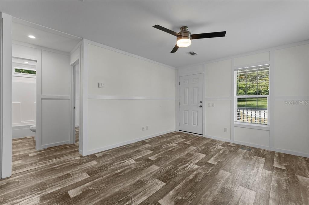 811 North Swindell Avenue, Unit 2 Lakeland, FL 33815 - Photo 16 of 33 wooden floor in an empty room with a window