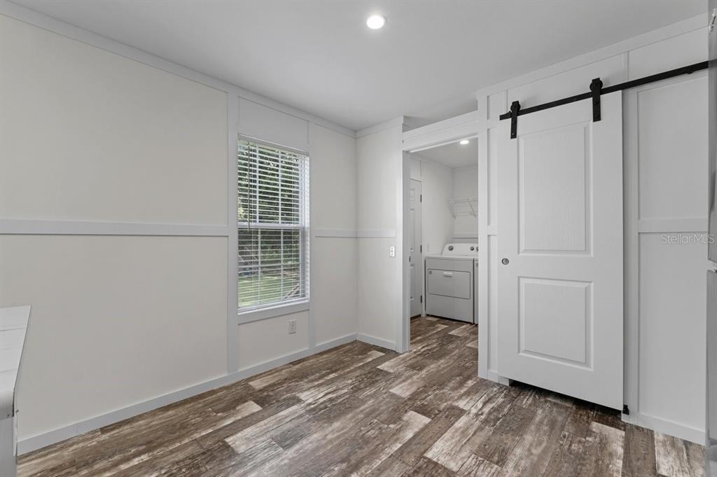 811 North Swindell Avenue, Unit 2 Lakeland, FL 33815 - Photo 17 of 33 a view of empty room with wooden floor and window