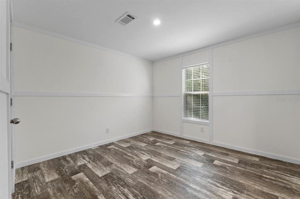811 North Swindell Avenue, Unit 2 Lakeland, FL 33815 - Photo 22 of 33 a view of empty room with wooden floor