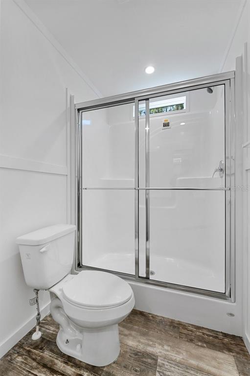 811 North Swindell Avenue, Unit 2 Lakeland, FL 33815 - Photo 27 of 33 a bathroom with a toilet a sink and a shower