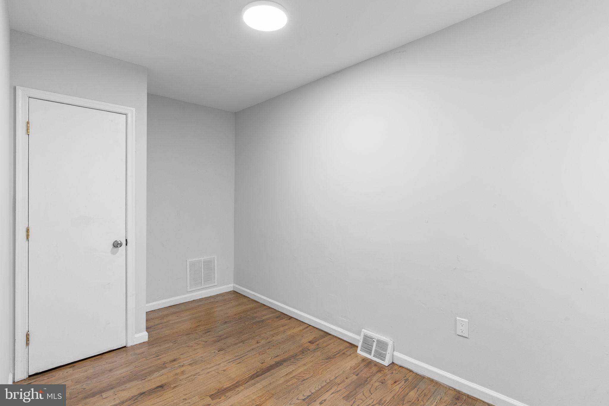 1020 Potter Street Chester, PA 19013 - Photo 19 of 26 a view of an empty room with wooden floor