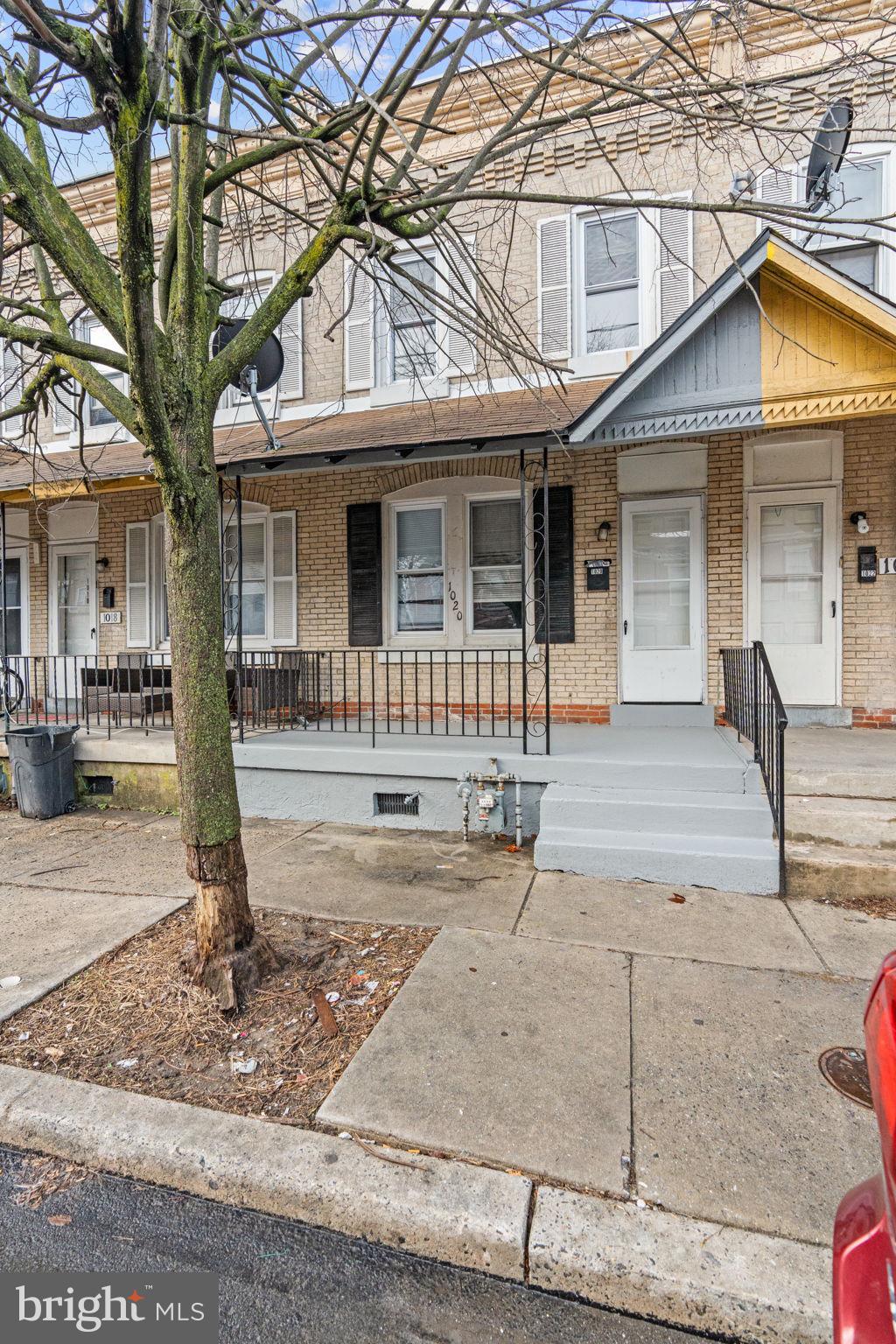 1020 Potter Street Chester, PA 19013 - Photo 2 of 26 a front view of a house with garden