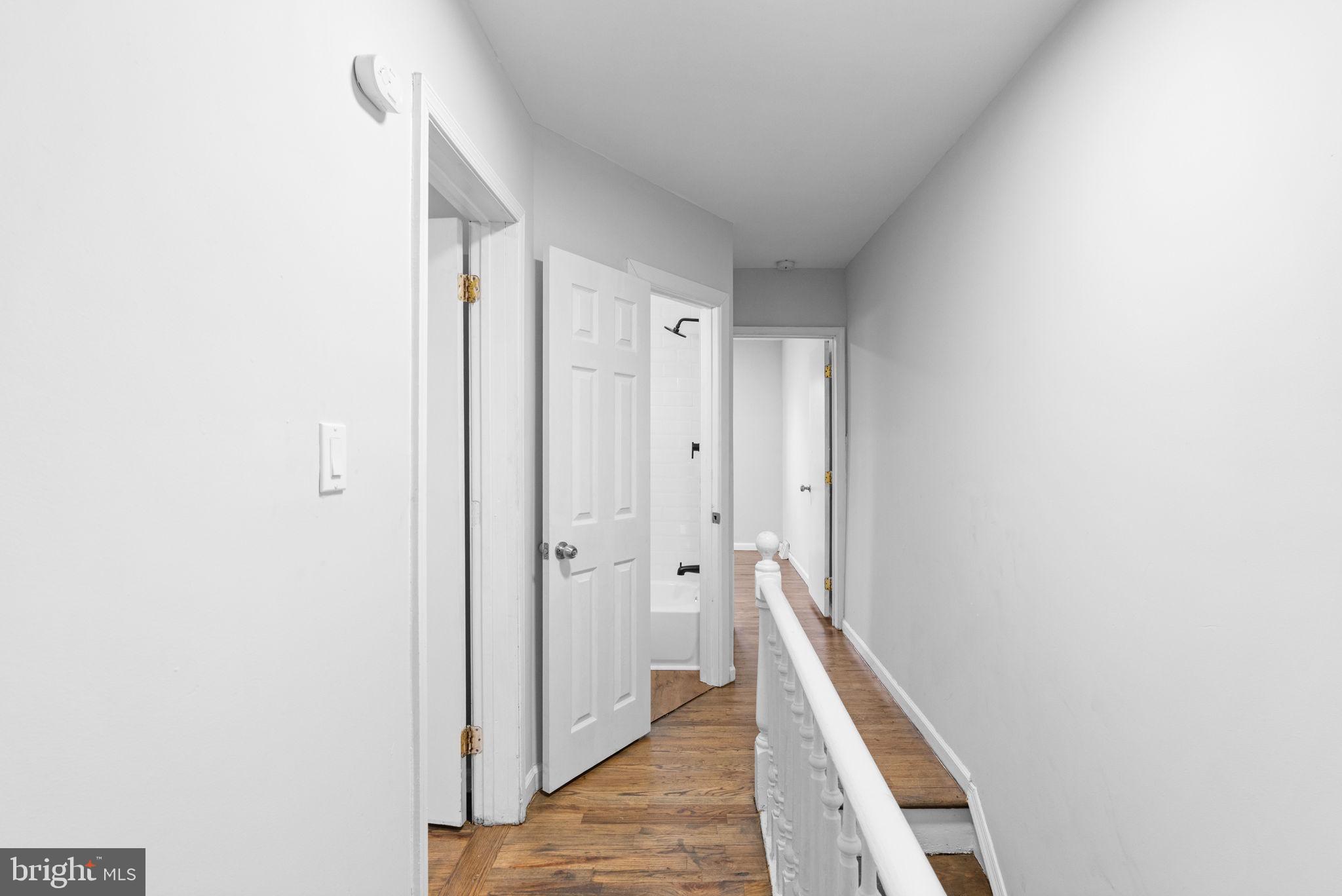 1020 Potter Street Chester, PA 19013 - Photo 22 of 26 a view of a hallway with wooden floor