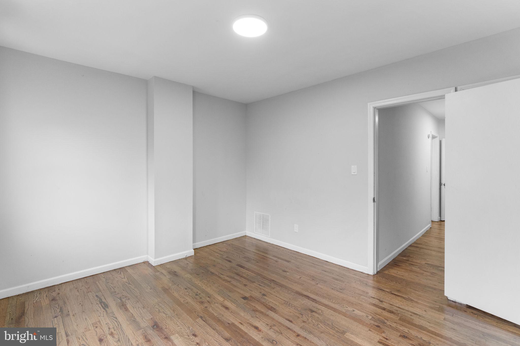 1020 Potter Street Chester, PA 19013 - Photo 24 of 26 a view of an empty room with wooden floor