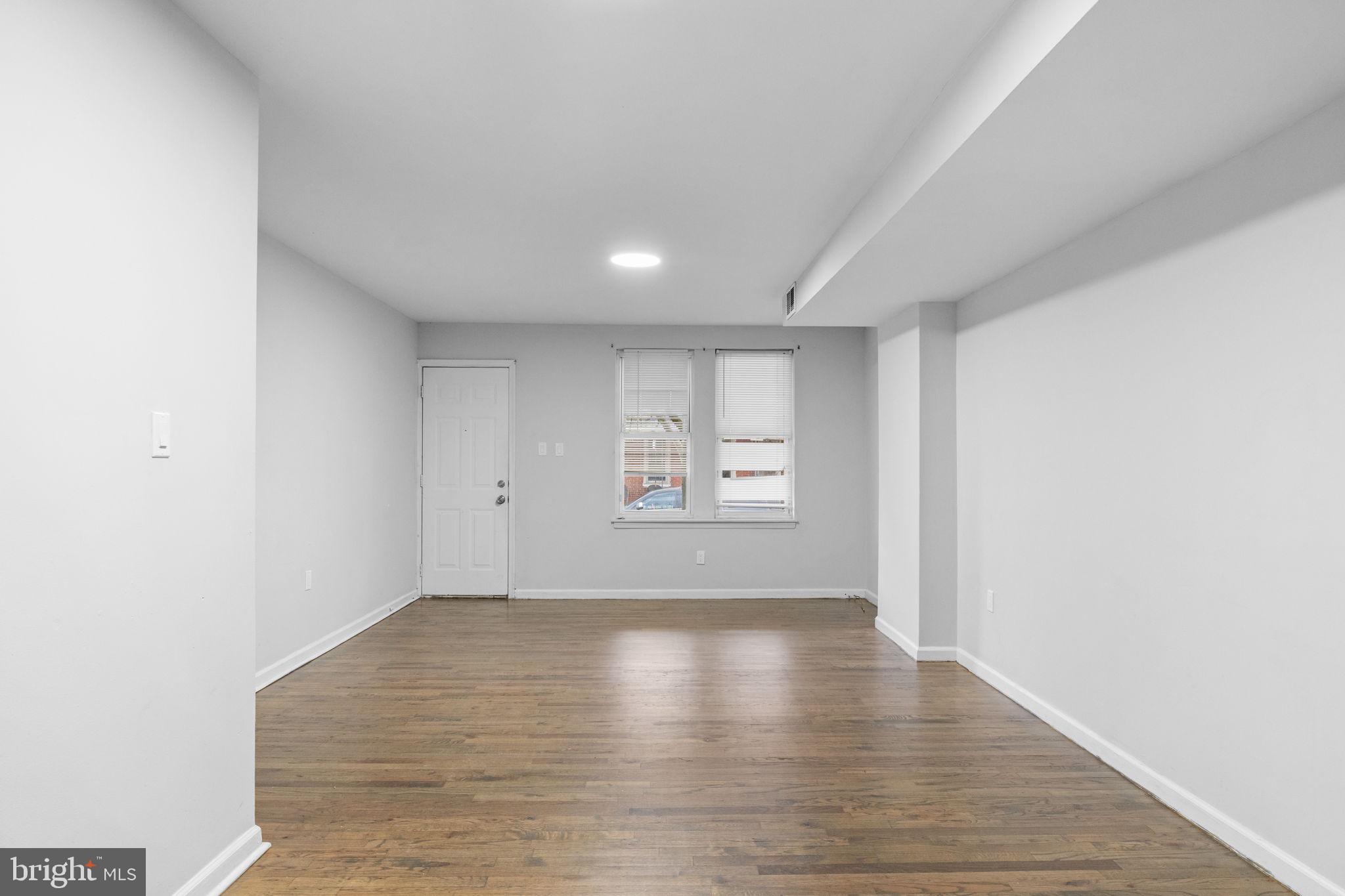 1020 Potter Street Chester, PA 19013 - Photo 6 of 26 a view of empty room with wooden floor and fan