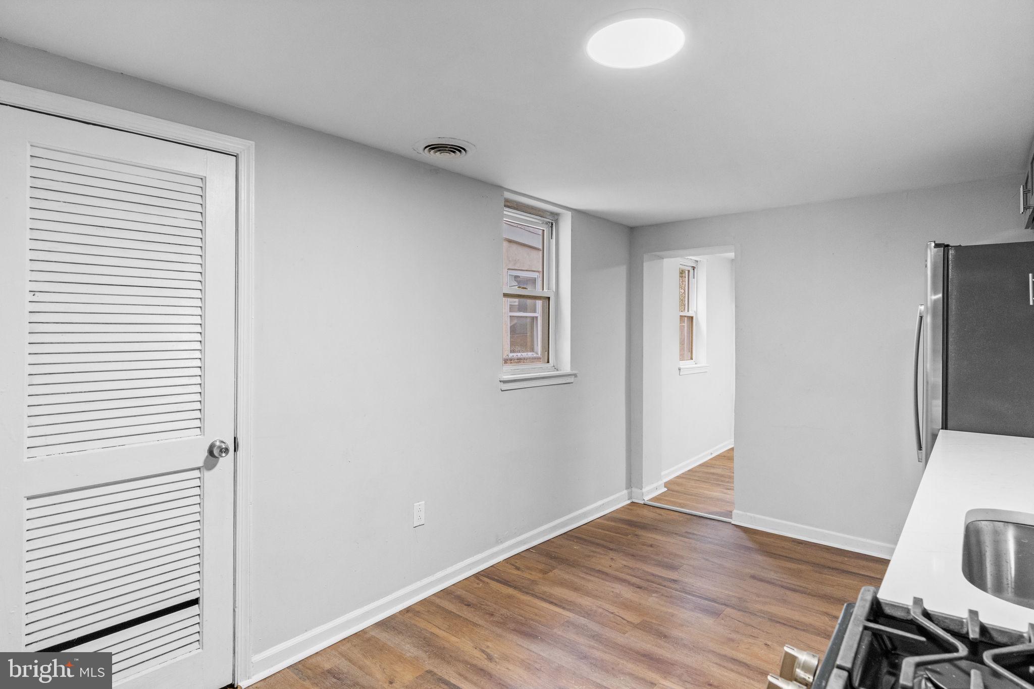 1020 Potter Street Chester, PA 19013 - Photo 9 of 26 a view of a livingroom with wooden floor and a ceiling fan