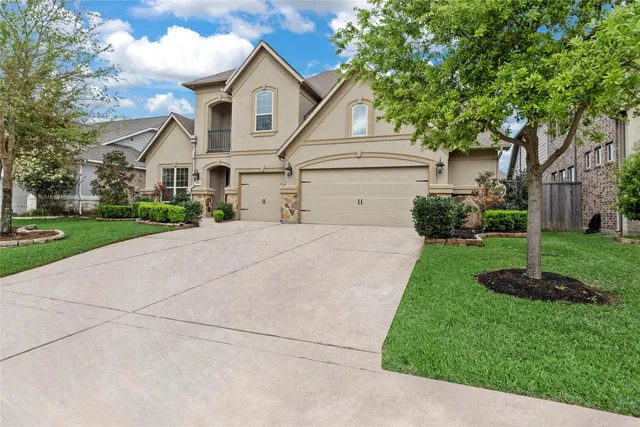 a view of a room with wooden floor chandelier and windows