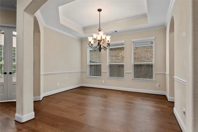 a kitchen with granite countertop a sink stove and cabinets