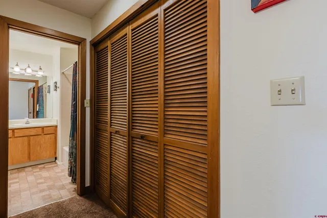 a view of bathroom with shower and mirror