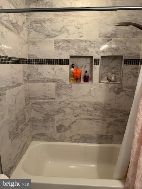 6357 Regal Oak Drive Springfield, VA 22152 - Photo 26 of 42 a bathroom with a shower and a bath tub