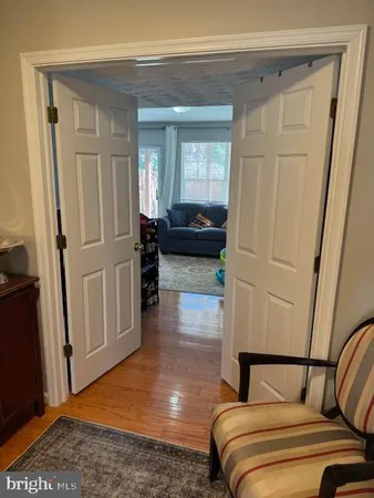 a bedroom with a bed and a mirror