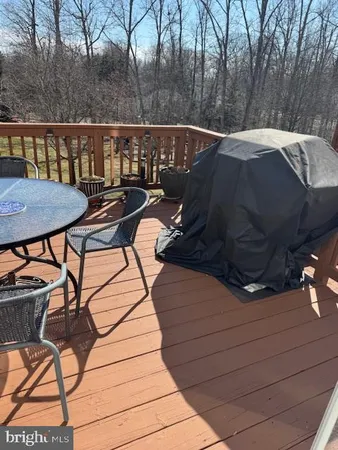 a view of a balcony with two chairs and a table